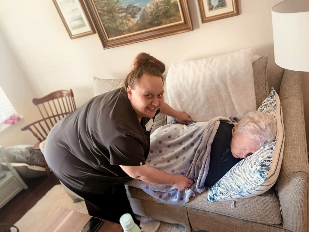 covering older woman with blanket